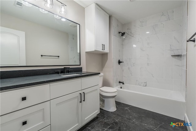 full bathroom with vanity, toilet, and tiled shower / bath