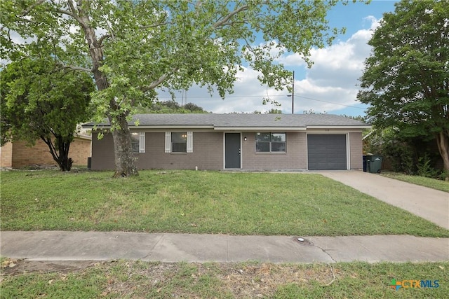 712 N 19th St, Copperas Cove, TX 76522 - single story home with a garage, driveway, brick siding, and a front lawn