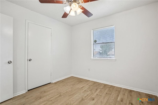 712 N 19th St, Copperas Cove, TX 76522 - unfurnished bedroom with light wood-style flooring, baseboards, and ceiling fan