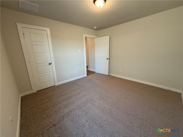 unfurnished bedroom with carpet flooring