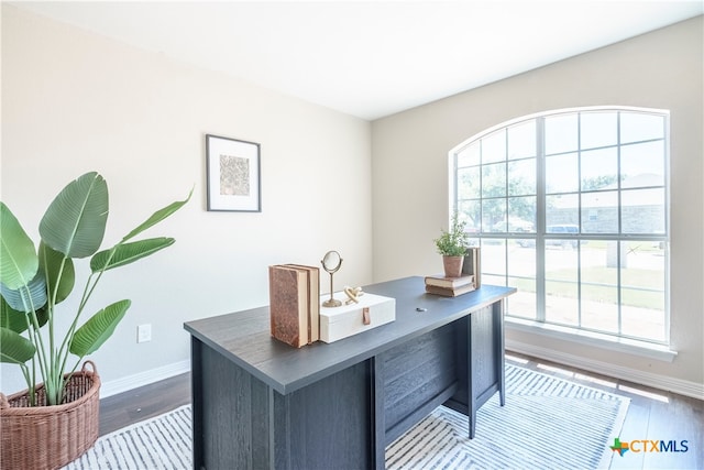 office area featuring dark wood-type flooring and a wealth of natural light