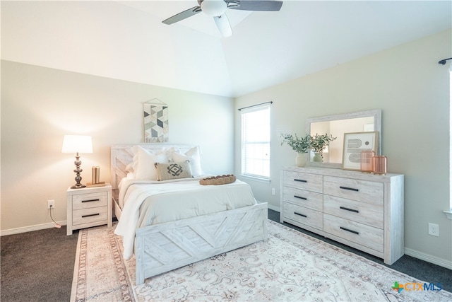 carpeted bedroom featuring ceiling fan and vaulted ceiling