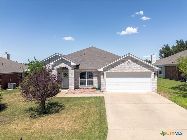 ranch-style house with central AC unit, a garage, and a front yard