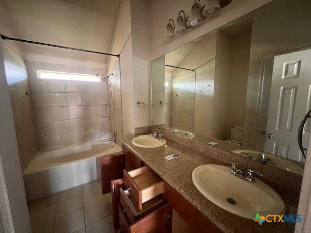 10234 Condor Loop, Waco, TX 76708 - full bathroom featuring shower / tub combination, tile patterned floors, and double vanity