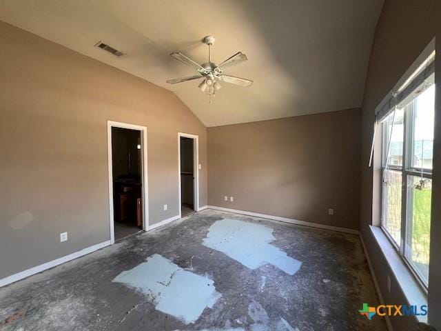 10234 Condor Loop, Waco, TX 76708 - unfurnished bedroom with multiple windows, lofted ceiling, a walk in closet, ensuite bath, and ceiling fan
