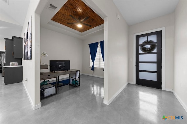 foyer entrance featuring baseboards, visible vents, a raised ceiling, wood ceiling, and concrete floors