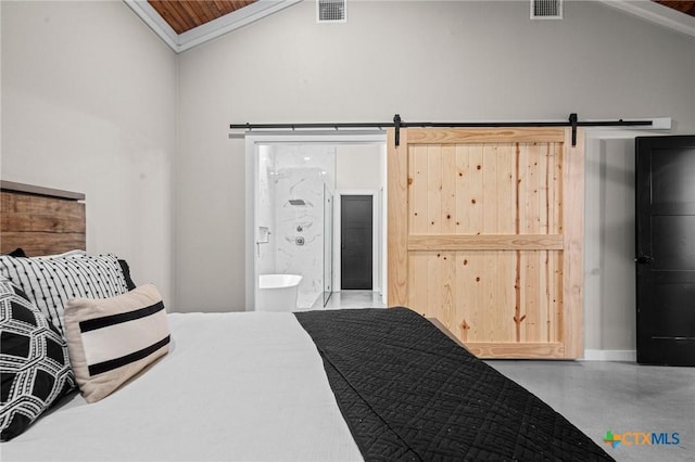 bedroom with finished concrete flooring, a barn door, visible vents, and connected bathroom