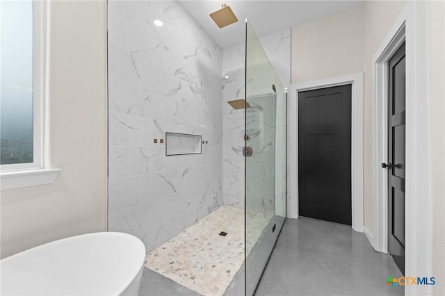 bathroom with a freestanding bath, finished concrete flooring, and a marble finish shower