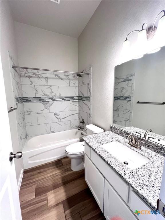 8302 Ridge Crest Dr, Killeen, TX 76542 - full bath featuring vanity, toilet, shower / tub combination, and wood finished floors