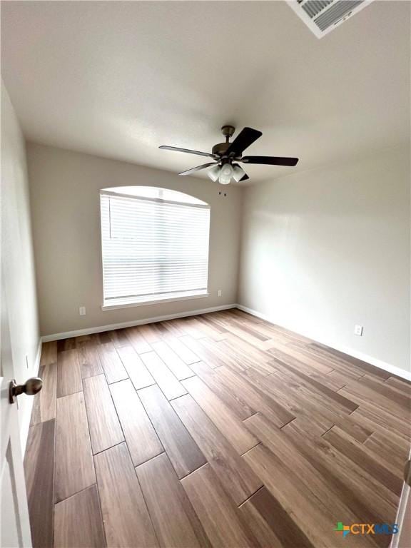 8302 Ridge Crest Dr, Killeen, TX 76542 - empty room featuring wood finished floors, ceiling fan, and baseboards