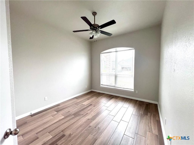 8302 Ridge Crest Dr, Killeen, TX 76542 - unfurnished room featuring baseboards, ceiling fan, and wood finished floors