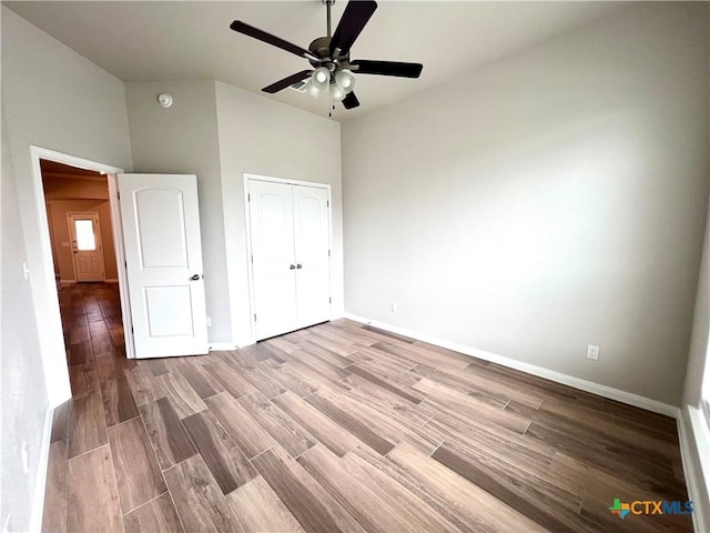 8302 Ridge Crest Dr, Killeen, TX 76542 - unfurnished bedroom featuring wood finished floors, baseboards, a closet, and ceiling fan