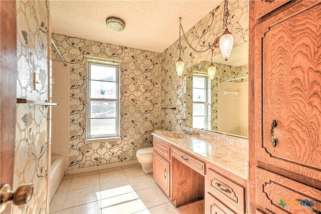 full bathroom featuring toilet, a healthy amount of sunlight, tile patterned floors, and a textured ceiling