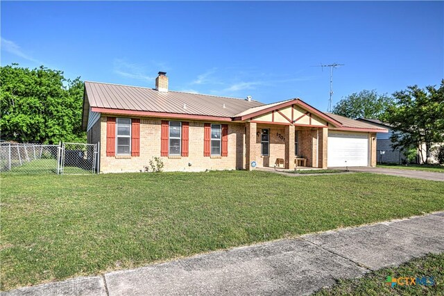 ranch-style house with a chimney, fence, a garage, a front yard, and aphalt driveway