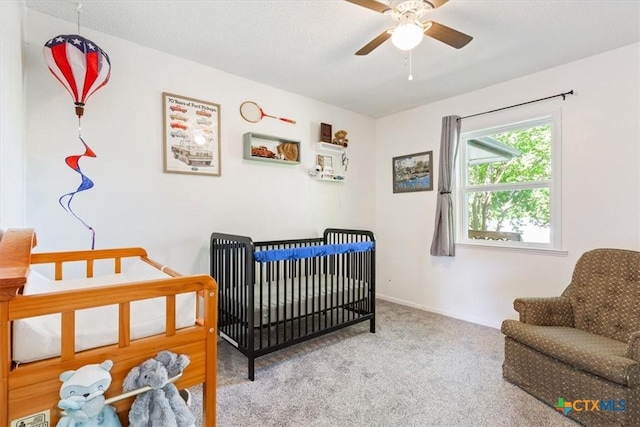 4005 Trailwood Dr, Temple, TX 76502 - bedroom with carpet flooring, baseboards, and a crib