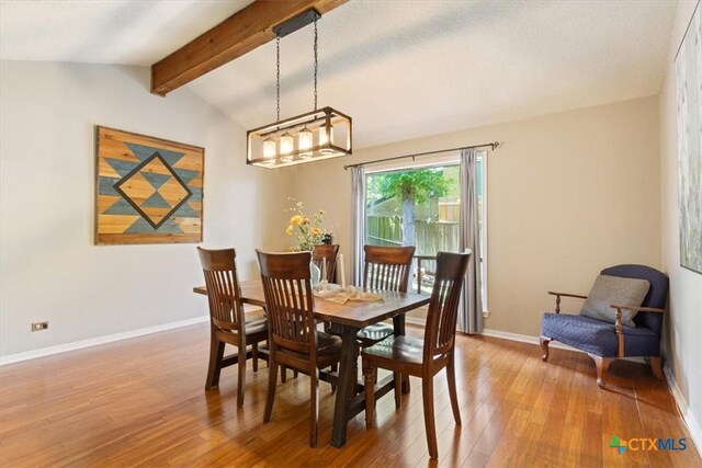 4005 Trailwood Dr, Temple, TX 76502 - dining space with hardwood / wood-style floors, vaulted ceiling with beams, and baseboards