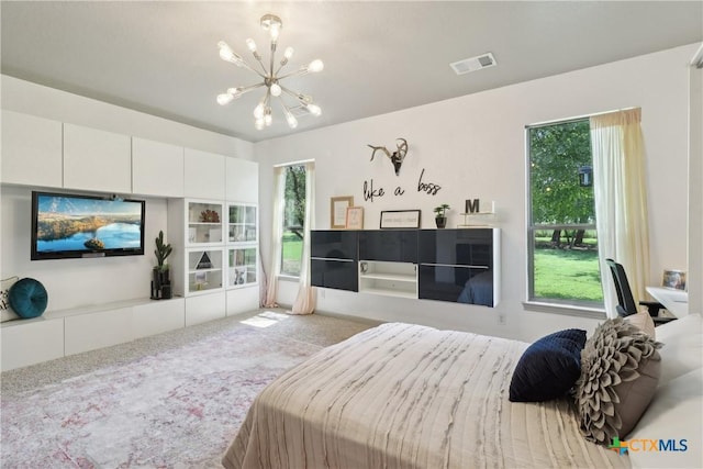 carpeted bedroom with an inviting chandelier and visible vents