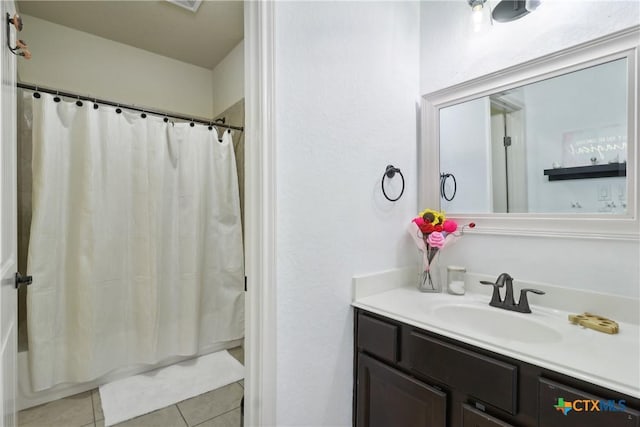full bathroom featuring shower / tub combo, tile patterned floors, and vanity