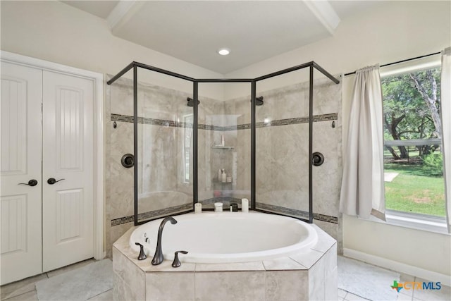 full bath featuring plenty of natural light, a garden tub, tile patterned flooring, and a stall shower
