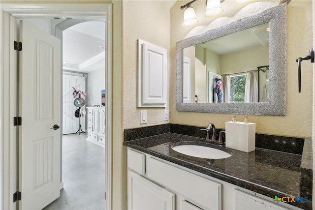 bathroom featuring vanity and concrete flooring