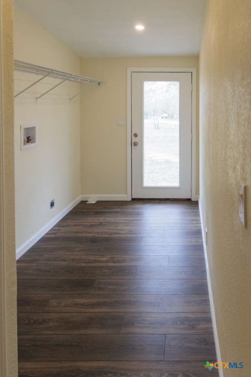 clothes washing area featuring washer hookup and dark hardwood / wood-style floors