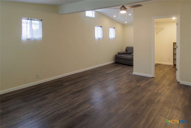 basement featuring dark hardwood / wood-style floors and ceiling fan