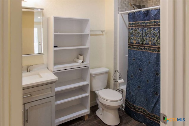 bathroom with wood-type flooring, toilet, vanity, and a shower with curtain