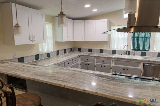 kitchen with white cabinetry, sink, light stone countertops, lofted ceiling, and island exhaust hood