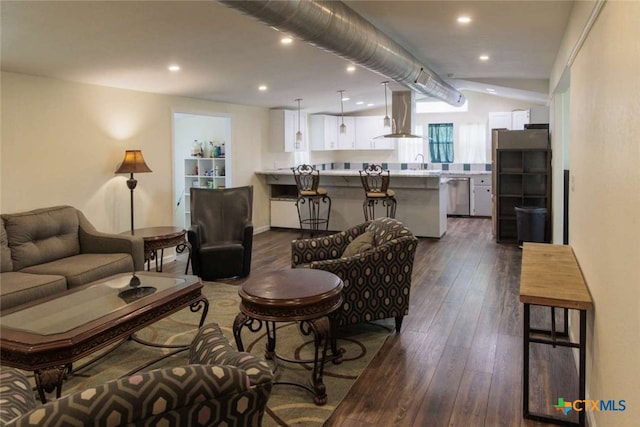 living room featuring lofted ceiling and dark hardwood / wood-style floors