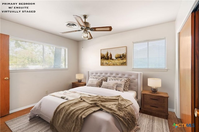 bedroom featuring hardwood / wood-style flooring, a closet, and ceiling fan