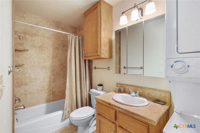 full bathroom with stacked washer / dryer, vanity, shower / tub combo, and toilet