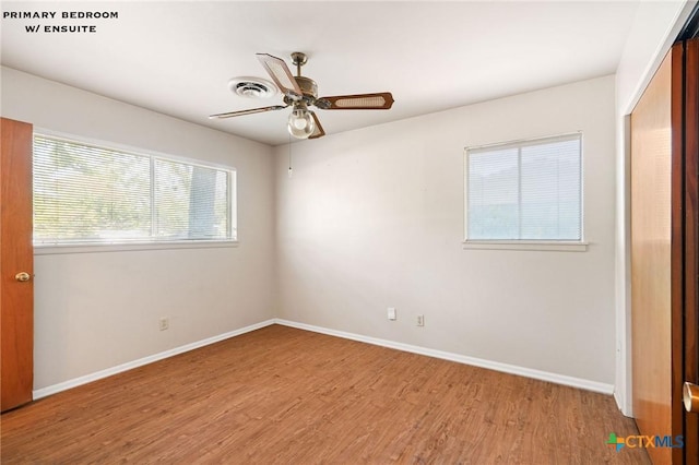 unfurnished room featuring ceiling fan and light wood-type flooring