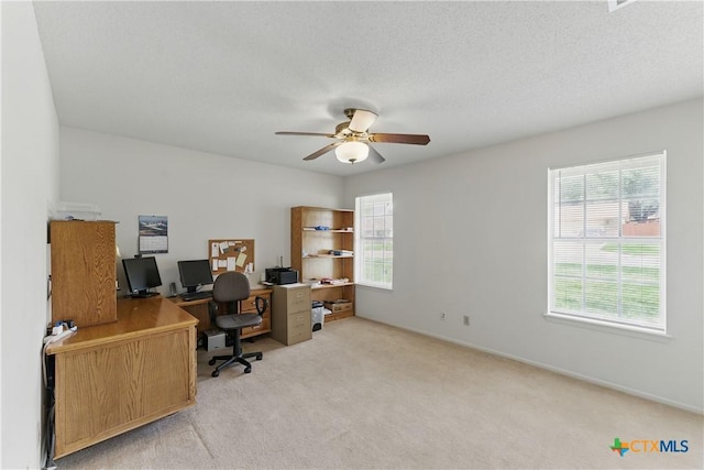 1233 Oakcrest Dr, Pleasanton, TX 78064 - home office with a ceiling fan and light carpet