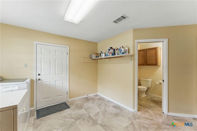 1233 Oakcrest Dr, Pleasanton, TX 78064 - laundry area featuring cabinet space and washer and clothes dryer
