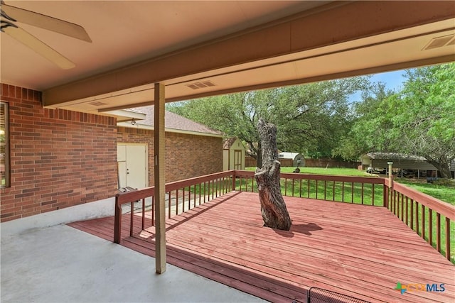 1233 Oakcrest Dr, Pleasanton, TX 78064 - deck with a storage unit and a lawn