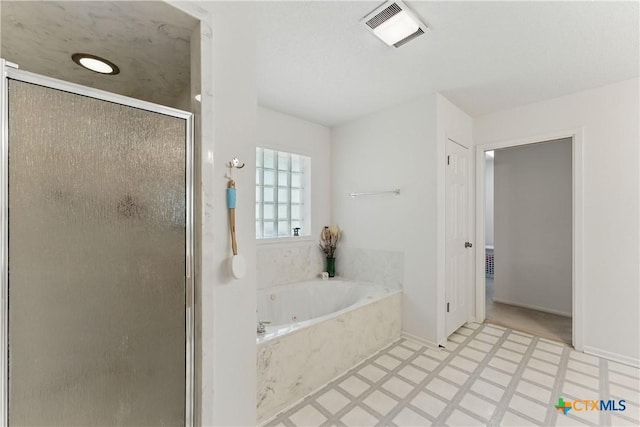 1233 Oakcrest Dr, Pleasanton, TX 78064 - full bath with a stall shower, tile patterned floors, and a whirlpool tub