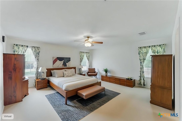 1233 Oakcrest Dr, Pleasanton, TX 78064 - bedroom with light colored carpet and ceiling fan
