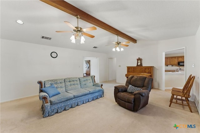 1233 Oakcrest Dr, Pleasanton, TX 78064 - living area with light carpet and ceiling fan
