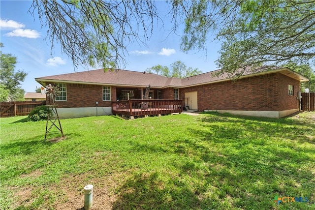 1233 Oakcrest Dr, Pleasanton, TX 78064 - rear view of house featuring brick siding and a wooden deck