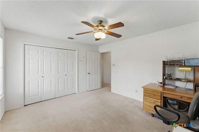 1233 Oakcrest Dr, Pleasanton, TX 78064 - office area with ceiling fan and carpet flooring