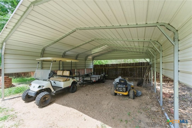 1233 Oakcrest Dr, Pleasanton, TX 78064 - view of vehicle parking with a detached carport