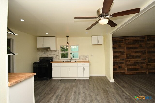314 Huerta St, San Antonio, TX 78207 - kitchen featuring a sink, dark wood finished floors, butcher block counters, and gas stove