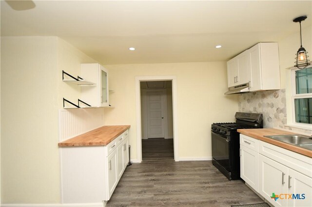 314 Huerta St, San Antonio, TX 78207 - kitchen with under cabinet range hood, a sink, butcher block counters, and black range with gas stovetop