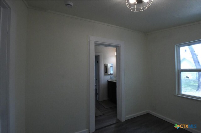 314 Huerta St, San Antonio, TX 78207 - empty room with baseboards, ornamental molding, and dark wood-type flooring