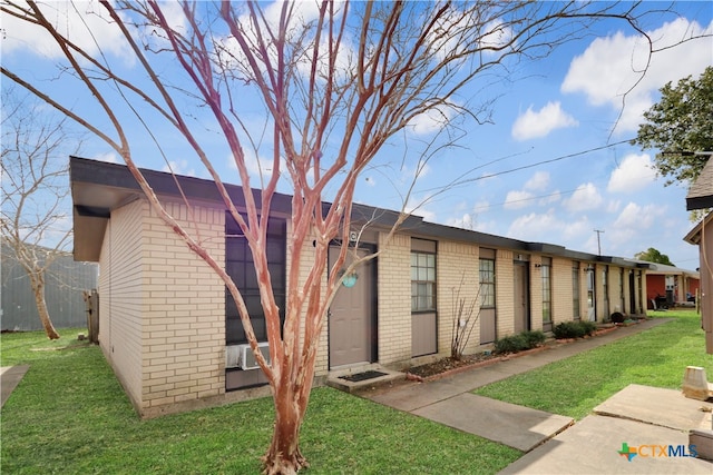 exterior space featuring a front lawn