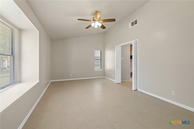 3317 Westrim Dr, Killeen, TX 76549 - empty room featuring ceiling fan, vaulted ceiling, baseboards, and light tile patterned floors