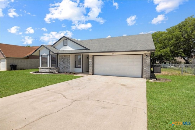 3317 Westrim Dr, Killeen, TX 76549 - view of front of property featuring a garage, brick siding, driveway, and cooling unit