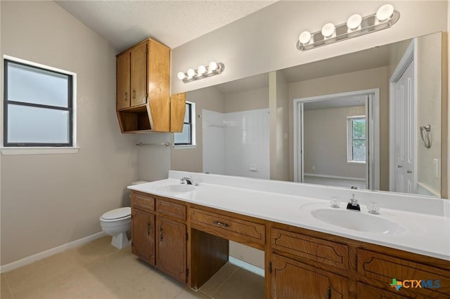 3317 Westrim Dr, Killeen, TX 76549 - full bath featuring double vanity, toilet, baseboards, a shower, and tile patterned floors