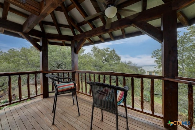 wooden terrace with a gazebo and ceiling fan