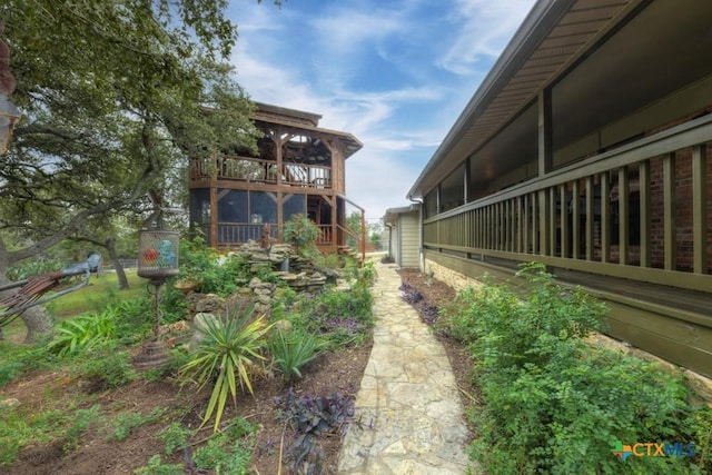 view of yard with a balcony